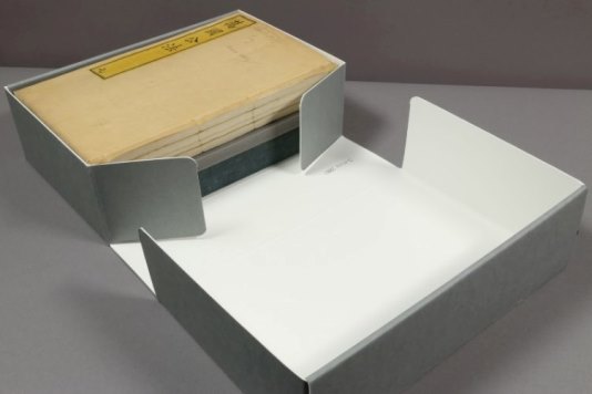 Conservation: Chinese manuscripts A large bound manuscript in a grey protective box