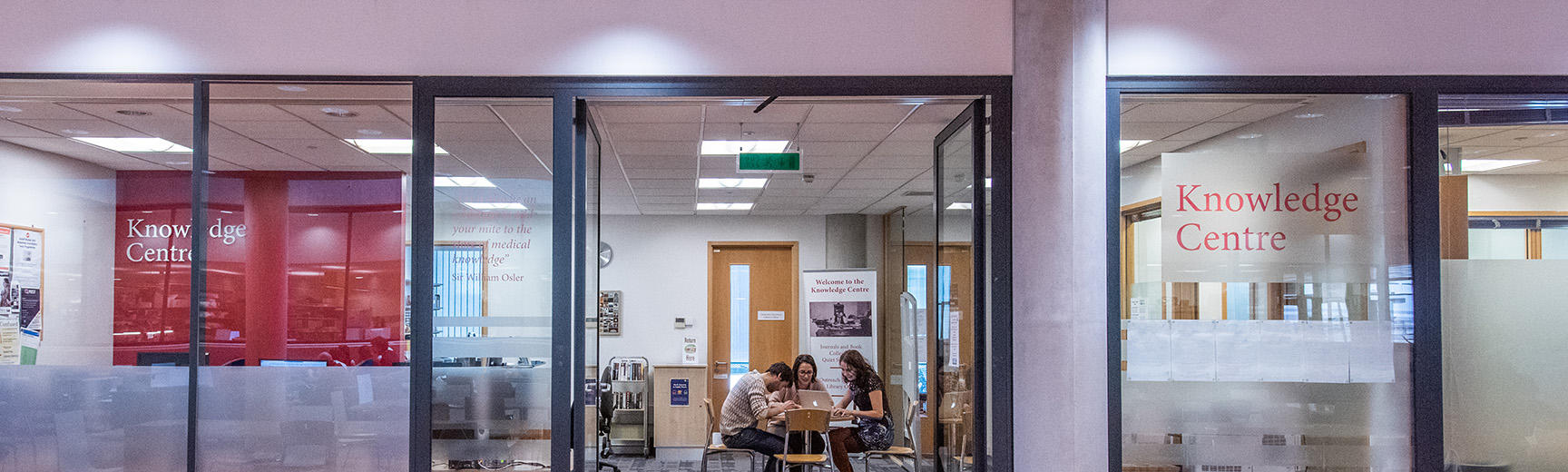 A glass wall and door, with the title Knowledge Centre written on the right pane